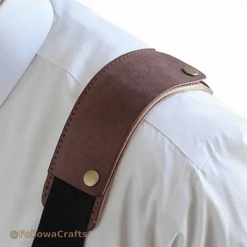 Leather camera shoulder pad on a camera strap