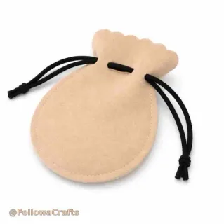 Round PU leather drawstring jewelry pouch on white background