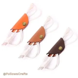Small round leather cord winder with earphones