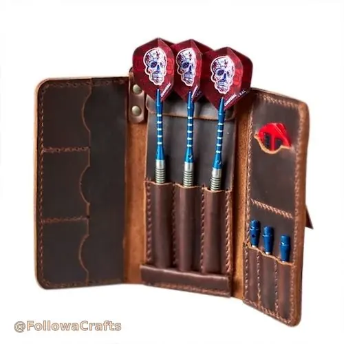 Black leather dart case open with darts and flights