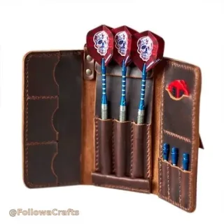 Black leather dart case open with darts and flights