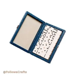 Brown leather domino box open with domino tiles