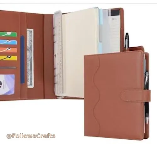 Refillable leather journal with pen loop and magnetic closure