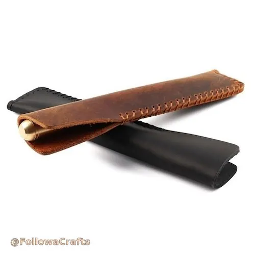 Brown leather pen sleeve with a black pen inserted