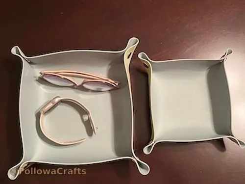 Foldable leather valet tray with snap corners on desk