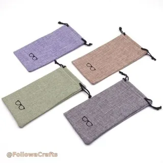 Natural linen drawstring pouch with sunglasses inside