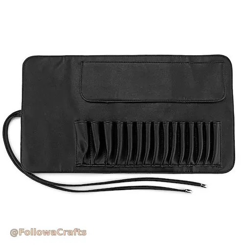 Vegan leather makeup brush roll open with brushes
