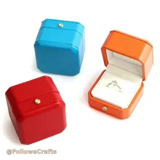 Velvet ring box with engagement ring inside